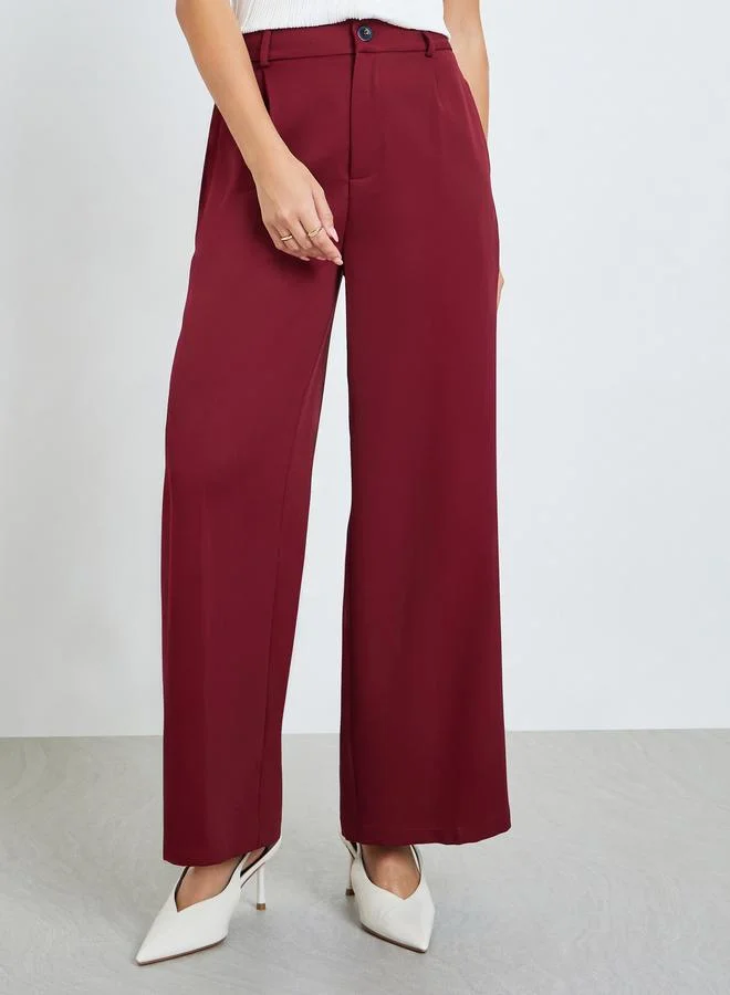 تايك تو بنطال عنابي سادة واسع الساق